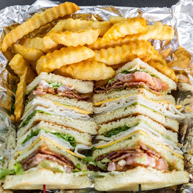 Turkey Club Sandwich with Fries.